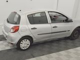 a picture of a small white car parked in a garage