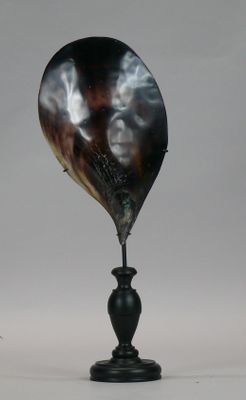 a black vase with a black and white design on it