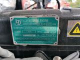 a close up of a sign on the engine of a vehicle