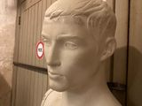 a white bust of a man in a room