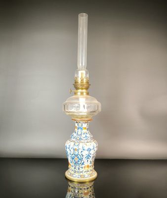 a glass lamp that is sitting on a table