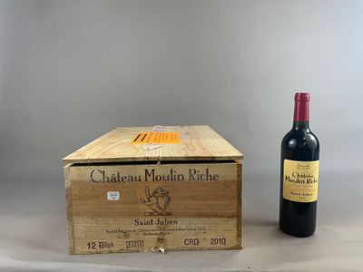 a wooden box with a bottle of wine next to it