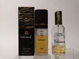 a bottle of cologne and a box of cologne on a table