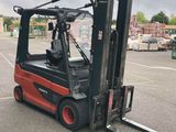 a fork lift truck parked in a parking lot
