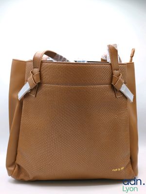 an image of a brown purse with a white tag on it