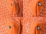 an orange suitcase with four pieces of luggage on top of it