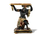 an image of a statue of a man holding a tray over his head
