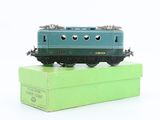 a toy train sitting on top of a green box