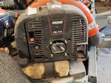 a chainsaw sitting on top of a cart in a garage