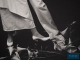 a black and white photo of a woman ' s legs and feet