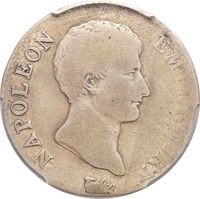 a close up of a coin with a man ' s face on it