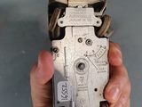 a person holding a metal device in their hand