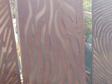 three pieces of wood are sitting next to each other on a cement surface