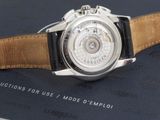 a close up of a watch on a book