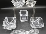 a group of clear glass objects sitting on top of a table