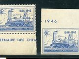deux timbres représentant un train, posés sur une table