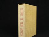 a book with a yellow cover sitting on top of a black surface