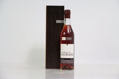 an image of a bottle of liquor sitting next to a wooden box