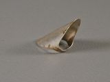 a close up of a silver ring on a table