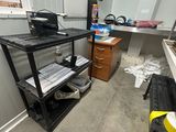 an image of a room with a desk and a printer