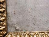 a picture of a gold frame with a ring on it