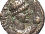 a close up of a coin with a woman on it