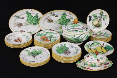 a lot of plates and bowls that are sitting on a table