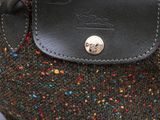 an image of a handbag with a leather handle