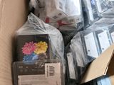 a cardboard box full of electronic devices and other items