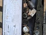 a box full of tools sitting on a wooden pallet