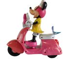 figurine de Mickey Mouse sur un scooter rose avec un chien
