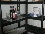 a room with a shelf and a chair in it