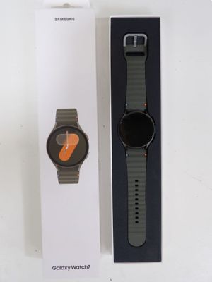 a box with a watch inside of it on a table