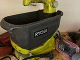 a yellow and black bucket with tools on a table
