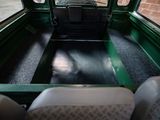 a view of the inside of a bus from the passenger seat
