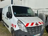 a white van parked in front of a building