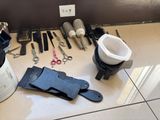 a lot of tools on the floor next to a can of paint