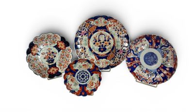 five plates with different designs and designs on them on a white surface