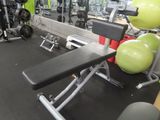 an image of a gym room with weights and exercise equipment