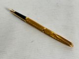 a pen that is laying on top of a piece of paper
