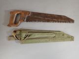 two saws that are sitting next to each other on a table
