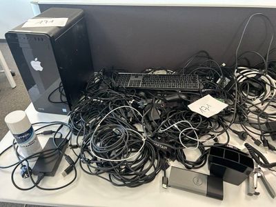 a desk with a bunch of wires and a computer on it