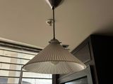 a lamp that is hanging from the ceiling in a room