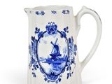 an image of a blue and white pitcher with a windmill on it