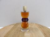 a bottle of alcohol sitting on top of a wooden table