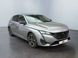 the silver car is parked in a large room with a black floor