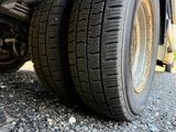a close up of a truck tire on the ground