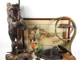a picture of a bear holding a rifle and other items