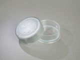 a glass jar with a lid sitting on a table