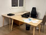 a desk and chair in the corner of a room